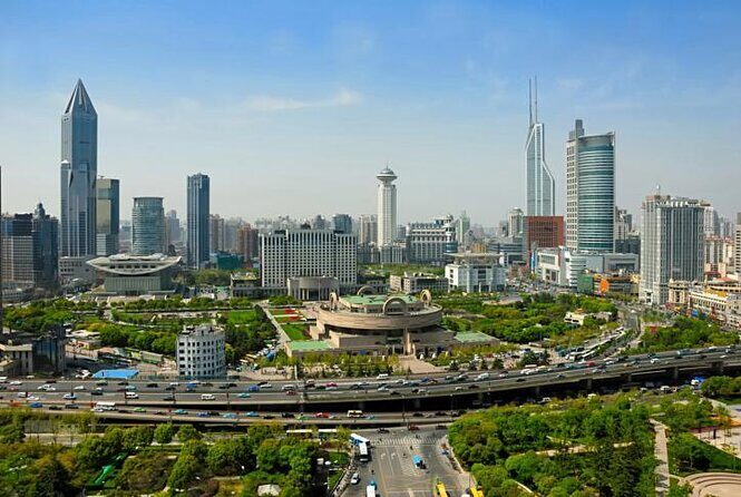 China Acrobatics Show and Shanghai Evening Tour - People’s Square at night: the big-city grid and city hall area
