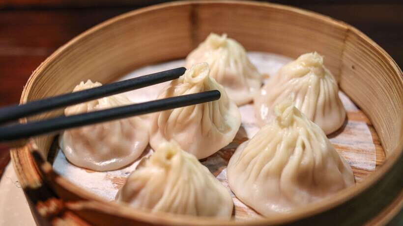 Shanghai: Evening Walking Food Tour - Soup dumplings first: how to choose real xiaolongbao