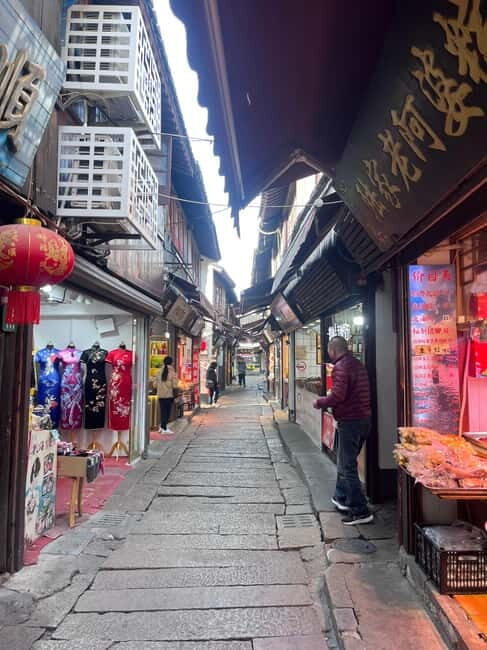 Shanghai: Zhujiajiao Water Town with Calligraphy Experience - Boat ride option: gliding the waterways at canal pace
