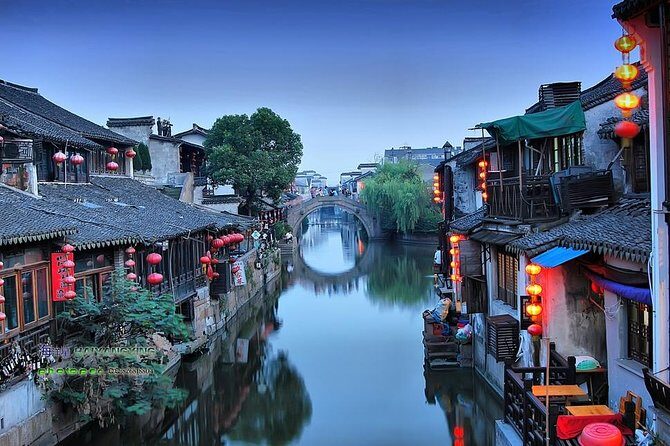 Xitang Water Village Sunset Tour with Riverside Dining Experience from Shanghai - Arriving in Xitang after dark: lantern alleys and the Tom Cruise corridor